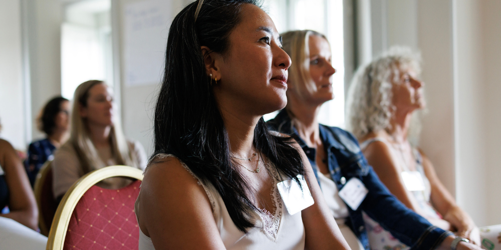 Employees listening to presentation