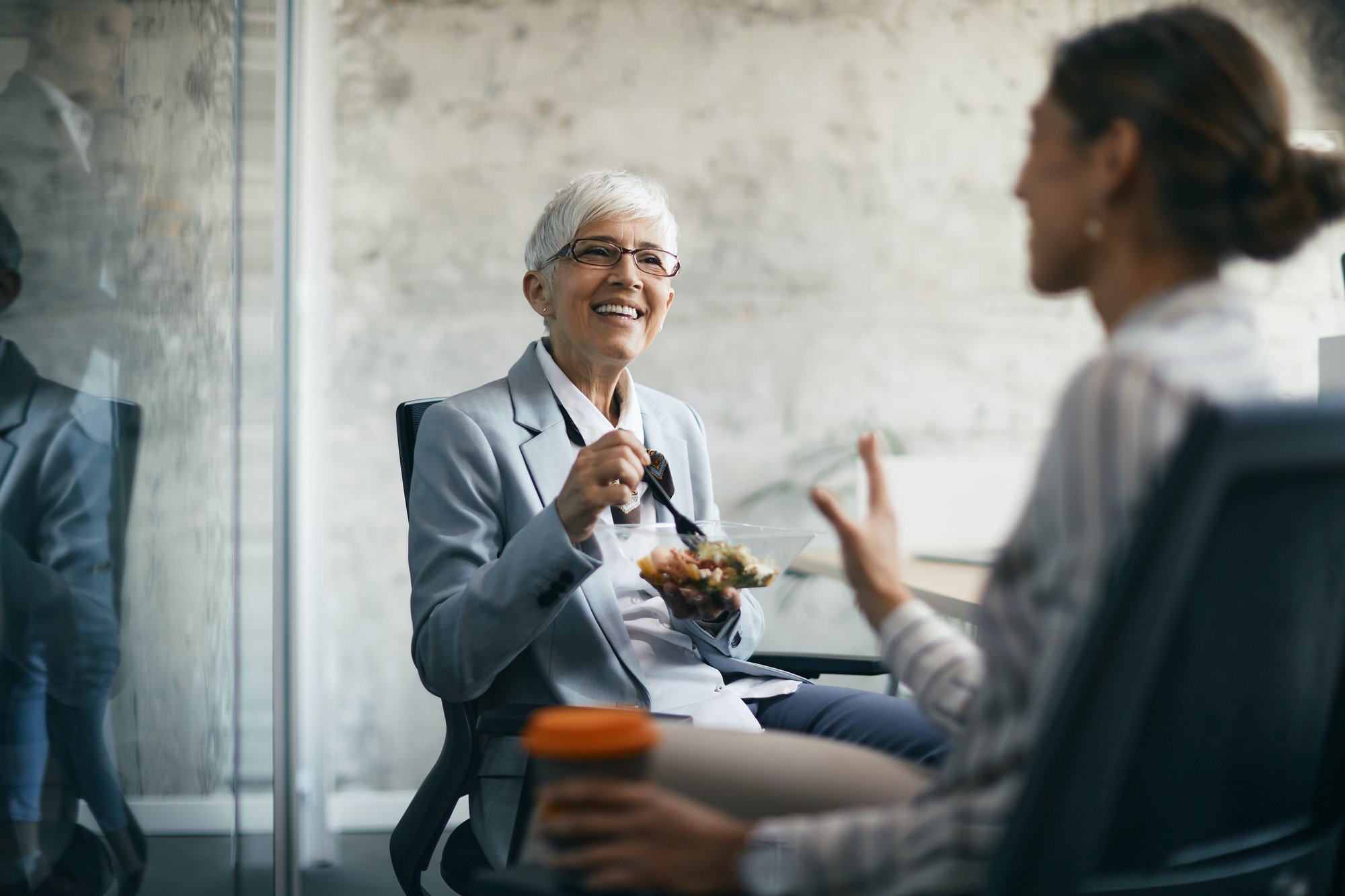 Workers talking while eating lunch