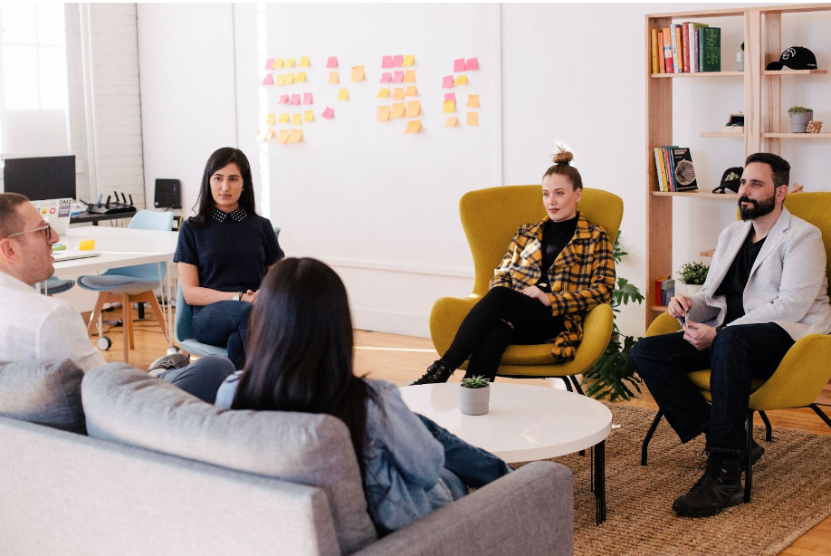 Team sitting around an office in discussion